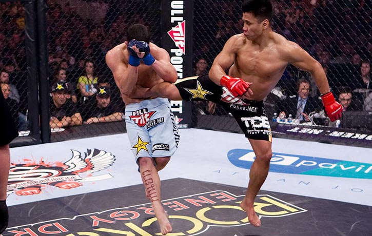 Cung lands a crushing jump spinning back kick on Scott Smith