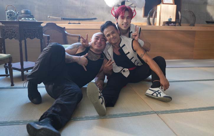 Brian Le with his brother Andy and their longtime friend D.Y. Sao on the set of Gladiator Underground.
