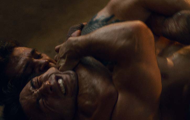 Joe traps his opponent in a rear naked choke.