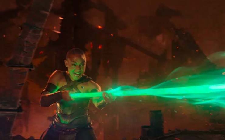 Jade channels all of her energy into her bo staff attack.